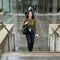 files/freepik__stacy-walking-up-three-concrete-steps-toward-a-gla__48386.webp